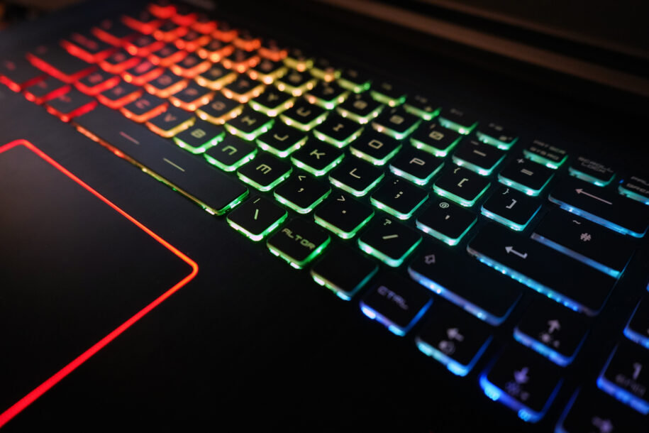 Gaming Laptop keyboard lit up by rainbow lights.