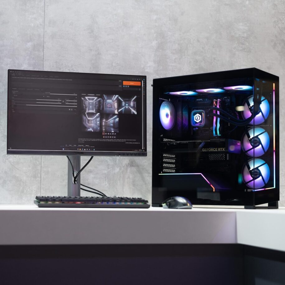 what is pc gaming? Picture of CyberPowerPC Gaming PC in glass PC case with components visible. The PC is to the right of a monitor.